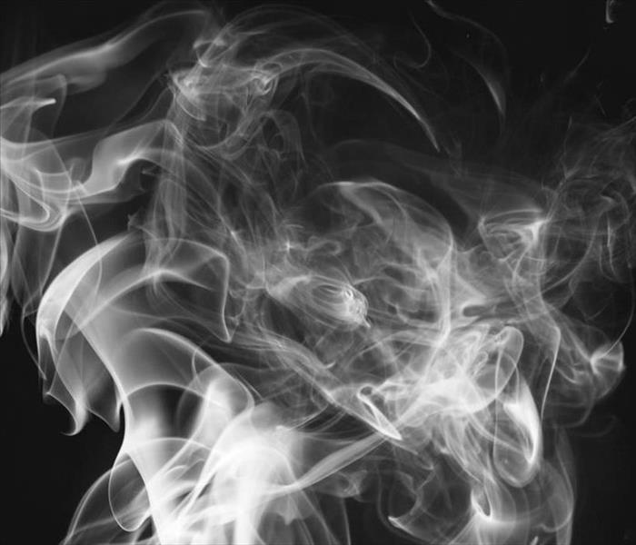 smoke wisps on a black background